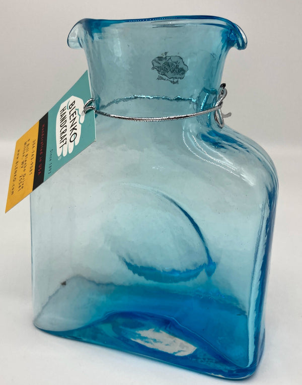 An ice blue mini glass water bottle.